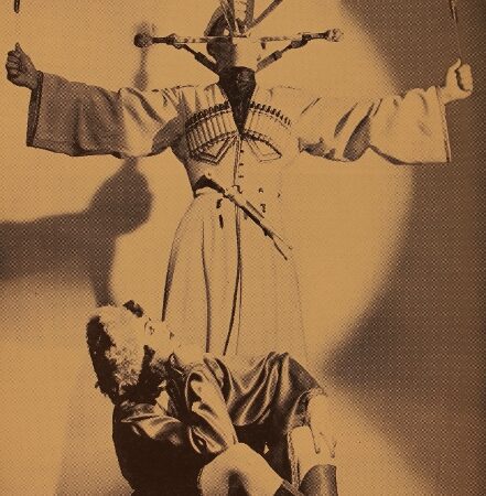 John Yervant in a Caucasian flaming sword dance with Felice watching